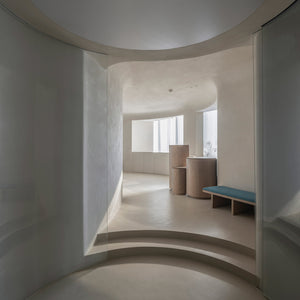 Chinese studio Atelier Right Hub created a cave-like spa in Hangzhou, China, with a network of interconnected, circular rooms and walls finished in white clay.